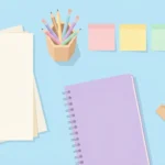 Pastel desk scene with paper, pencils, sticky notes, a paper clip holder, a notebook and a ruler on sky blue.